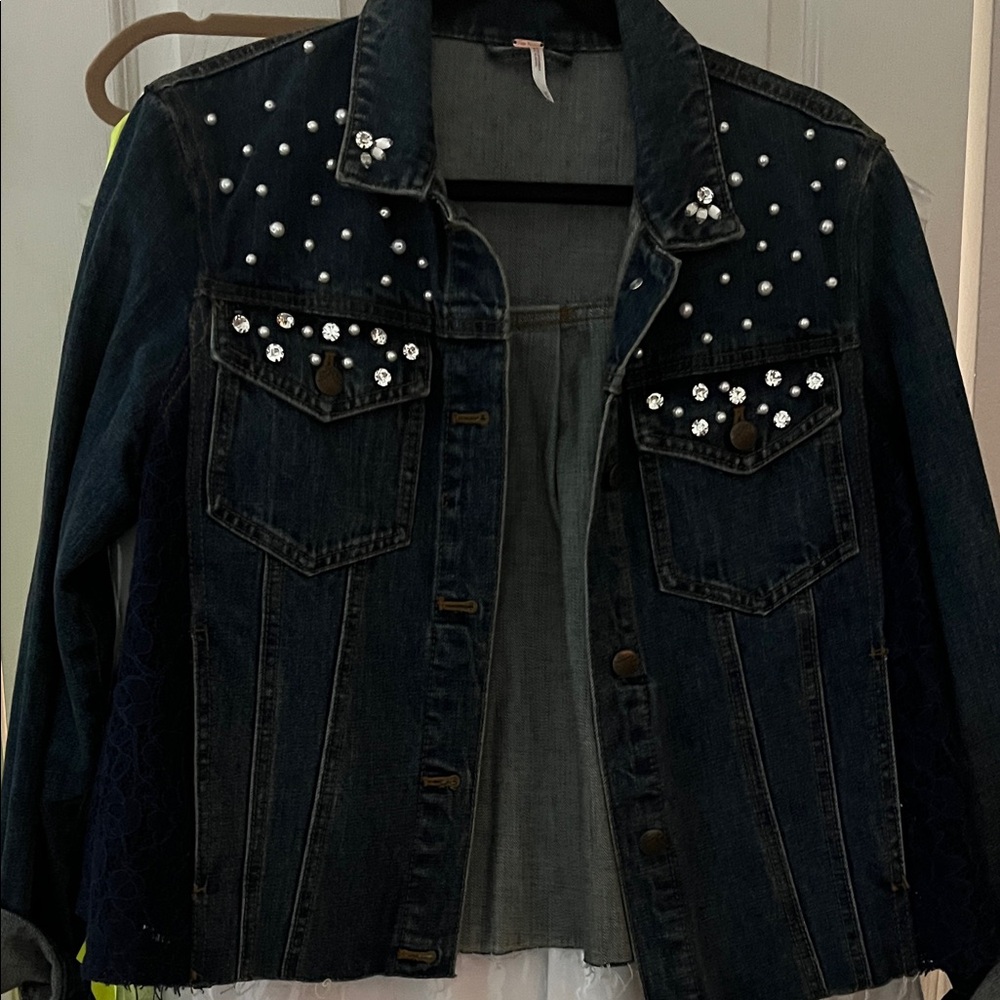 Embellished Denim Jacket with lace on side.  No holes or rips